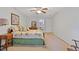 Bedroom with neutral walls, ceiling fan, and view to the bathroom at 3527 Starwood Sw Trl, Lilburn, GA 30047