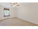 Bedroom featuring a large window seat with colorful pillows and a ceiling fan at 3527 Starwood Sw Trl, Lilburn, GA 30047