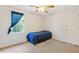 Bedroom with a ceiling fan and a window providing natural light at 3527 Starwood Sw Trl, Lilburn, GA 30047