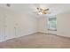 Spacious bedroom featuring a window seat and neutral carpet at 3527 Starwood Sw Trl, Lilburn, GA 30047