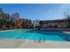 Sparkling community pool with clear blue water, perfect for swimming and relaxation, surrounded by trees and a covered area at 3527 Starwood Sw Trl, Lilburn, GA 30047