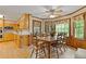 Bright dining area with wood table and floral window treatments at 3527 Starwood Sw Trl, Lilburn, GA 30047