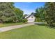 Beautiful landscaping and a well-maintained lawn complement the long driveway at 3527 Starwood Sw Trl, Lilburn, GA 30047