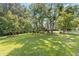 Spacious front lawn and beautiful trees accent this property's exterior at 3527 Starwood Sw Trl, Lilburn, GA 30047