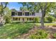 Charming home with a welcoming front porch and beautifully landscaped front yard at 3527 Starwood Sw Trl, Lilburn, GA 30047