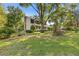 Well-maintained lawn surrounds a home with a classic architectural style and brick chimney at 3527 Starwood Sw Trl, Lilburn, GA 30047