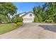 Two-car garage with well-kept grounds and a neatly paved driveway at 3527 Starwood Sw Trl, Lilburn, GA 30047