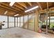Enclosed garage featuring a concrete floor, wood beams, and corrugated metal walls at 3527 Starwood Sw Trl, Lilburn, GA 30047