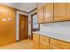 Charming kitchen featuring wood cabinets and a tile backsplash at 3527 Starwood Sw Trl, Lilburn, GA 30047
