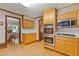 Bright kitchen with stainless steel appliances and wooden cabinetry at 3527 Starwood Sw Trl, Lilburn, GA 30047