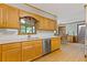 Kitchen showcasing stainless steel appliances and wood cabinets at 3527 Starwood Sw Trl, Lilburn, GA 30047