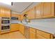 Kitchen with stainless steel appliances and ample cabinet space at 3527 Starwood Sw Trl, Lilburn, GA 30047