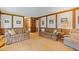 Traditional living room with hardwood floors, paneled walls, and comfortable upholstered seating at 3527 Starwood Sw Trl, Lilburn, GA 30047