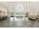 Spacious ballroom with high ceilings, elegant chandeliers, bar, and large windows at 5045 Harrington Rd, Johns Creek, GA 30022