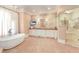 Luxurious bathroom with soaking tub, double vanity, walk-in shower, and decorative wallpaper at 5045 Harrington Rd, Johns Creek, GA 30022