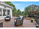 Outdoor deck with chairs overlooking the backyard at 5045 Harrington Rd, Johns Creek, GA 30022