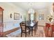 Traditional dining room with a chandelier, and an ornate wooden dining table with seating for eight at 5045 Harrington Rd, Johns Creek, GA 30022