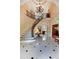 Elegant foyer with a curved staircase, chandelier, and marble flooring, creating a grand and welcoming entrance at 5045 Harrington Rd, Johns Creek, GA 30022