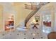 Grand foyer with a sweeping staircase, marble floors, and views into the dining and living spaces at 5045 Harrington Rd, Johns Creek, GA 30022