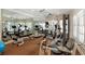 Home gym equipped with various weight machines, mirrored walls, and exercise equipment at 5045 Harrington Rd, Johns Creek, GA 30022