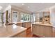 Bright kitchen with stainless steel appliances, double island, and hardwood floors at 5045 Harrington Rd, Johns Creek, GA 30022