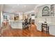 Open-concept kitchen with an island, stainless steel appliances, custom cabinetry, and a breakfast bar at 5045 Harrington Rd, Johns Creek, GA 30022
