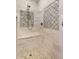 Stylish shower with mosaic tile, bench, and modern fixtures providing a spa-like experience at 5045 Harrington Rd, Johns Creek, GA 30022