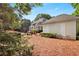 Beautiful backyard featuring a home with a pool, manicured lawn, a trellised path, and mature trees at 5045 Harrington Rd, Johns Creek, GA 30022
