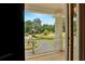 Balcony view overlooking the fountain, professionally landscaped circular driveway, and mature trees at 5045 Harrington Rd, Johns Creek, GA 30022