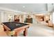 Spacious finished basement with a pool table, recessed lighting, and open access to the rest of the home at 5045 Harrington Rd, Johns Creek, GA 30022