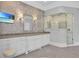 This bathroom features dual vanities, decorative wallpaper, and a large glass shower stall at 5045 Harrington Rd, Johns Creek, GA 30022