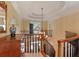 Foyer with staircase, chandelier, decorative wallpaper, and a view of the outdoors at 5045 Harrington Rd, Johns Creek, GA 30022