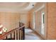 Upstairs foyer featuring decorative wallpaper, a chandelier, and access to the balcony at 5045 Harrington Rd, Johns Creek, GA 30022