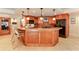 Spacious kitchen with a large center island, custom wood cabinets, and stainless steel appliances at 5045 Harrington Rd, Johns Creek, GA 30022