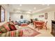 Spacious living area with comfortable seating, a game table, and a warm, inviting atmosphere at 5045 Harrington Rd, Johns Creek, GA 30022