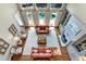 Bright living room with high ceilings, a fireplace, hardwood floors and large windows overlooking the backyard pool at 5045 Harrington Rd, Johns Creek, GA 30022