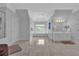 Bright and airy main bathroom with a large soaking tub, double sink vanity, and neutral tile flooring at 5045 Harrington Rd, Johns Creek, GA 30022