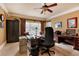 Home office with a large desk, cabinets, and a window for natural light at 5045 Harrington Rd, Johns Creek, GA 30022