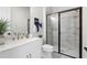 Sleek bathroom featuring a modern glass enclosed shower, updated vanity, and stylish fixtures at 515 Godfrey Dr, Cumming, GA 30040
