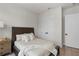 This cozy bedroom features warm lighting, a wood-frame bed, and neutral decor for a relaxing ambiance at 515 Godfrey Dr, Cumming, GA 30040