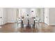 Elegant dining room with a view to an outdoor seating area, hardwood floors, and light walls at 515 Godfrey Dr, Cumming, GA 30040