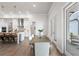 Dining room with kitchen access and an outdoor view, hardwood floors and light fixtures at 515 Godfrey Dr, Cumming, GA 30040