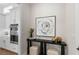 Tastefully decorated entryway featuring a black console table with artistic decor at 515 Godfrey Dr, Cumming, GA 30040
