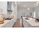Gourmet kitchen with stainless steel appliances, white cabinets, and a quartz island, perfect for entertaining at 515 Godfrey Dr, Cumming, GA 30040