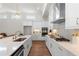Modern kitchen featuring white cabinetry, stainless appliances, quartz countertops, and an open layout for easy living at 515 Godfrey Dr, Cumming, GA 30040