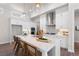 Modern kitchen with a center island, quartz countertop, and stainless steel appliances at 515 Godfrey Dr, Cumming, GA 30040