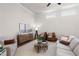 Well-lit living room with neutral colors, modern furnishings, and hardwood floors at 515 Godfrey Dr, Cumming, GA 30040