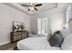 Bright and airy main bedroom suite with tray ceilings, large windows, and stylish furnishings at 515 Godfrey Dr, Cumming, GA 30040