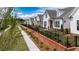 Charming street view highlighting the beautiful brick accents and manicured landscaping of homes at 515 Godfrey Dr, Cumming, GA 30040