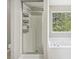 Bathroom featuring a separate shower, soaking tub, and a window overlooking the backyard at 915 Terance Ave, Jonesboro, GA 30238